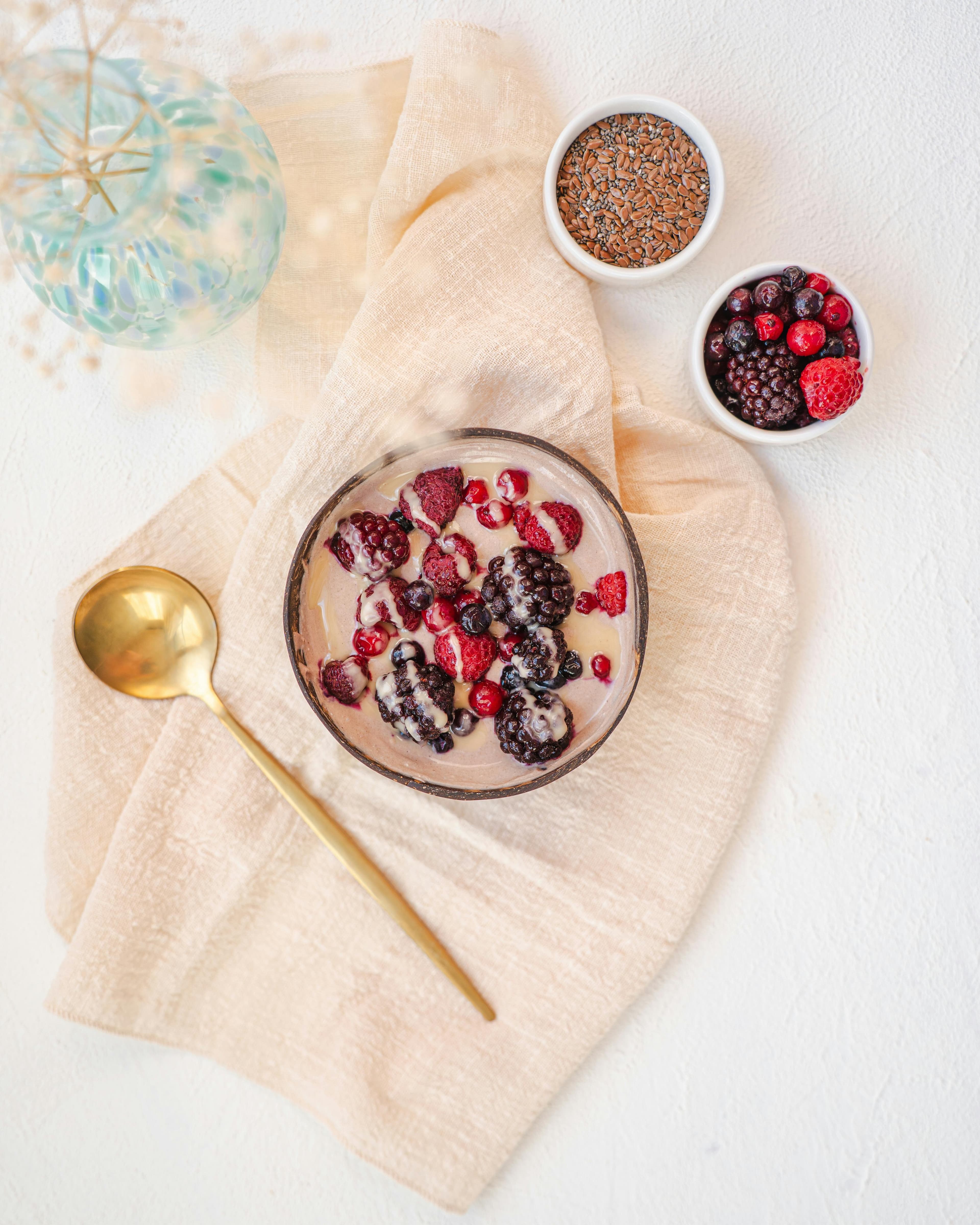 Greek yogurt bowl with berries, chia seeds, nuts, and almond butter